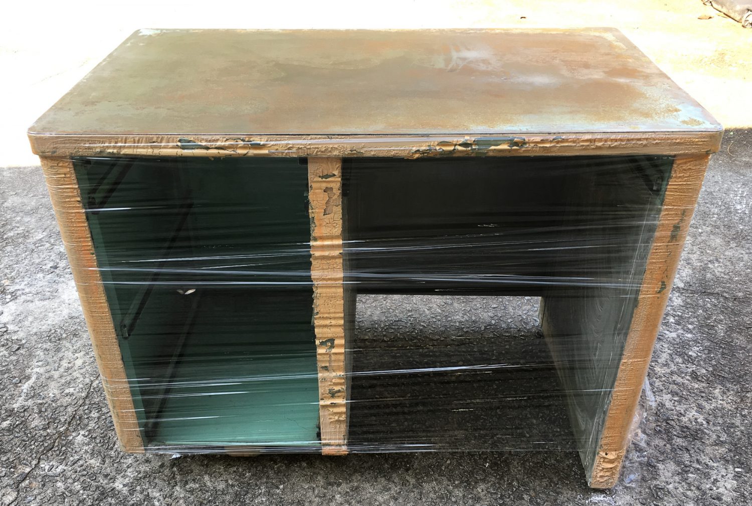 mid century steel tanker desk, paint stripping using Citristrip then covering with plastic wrap.