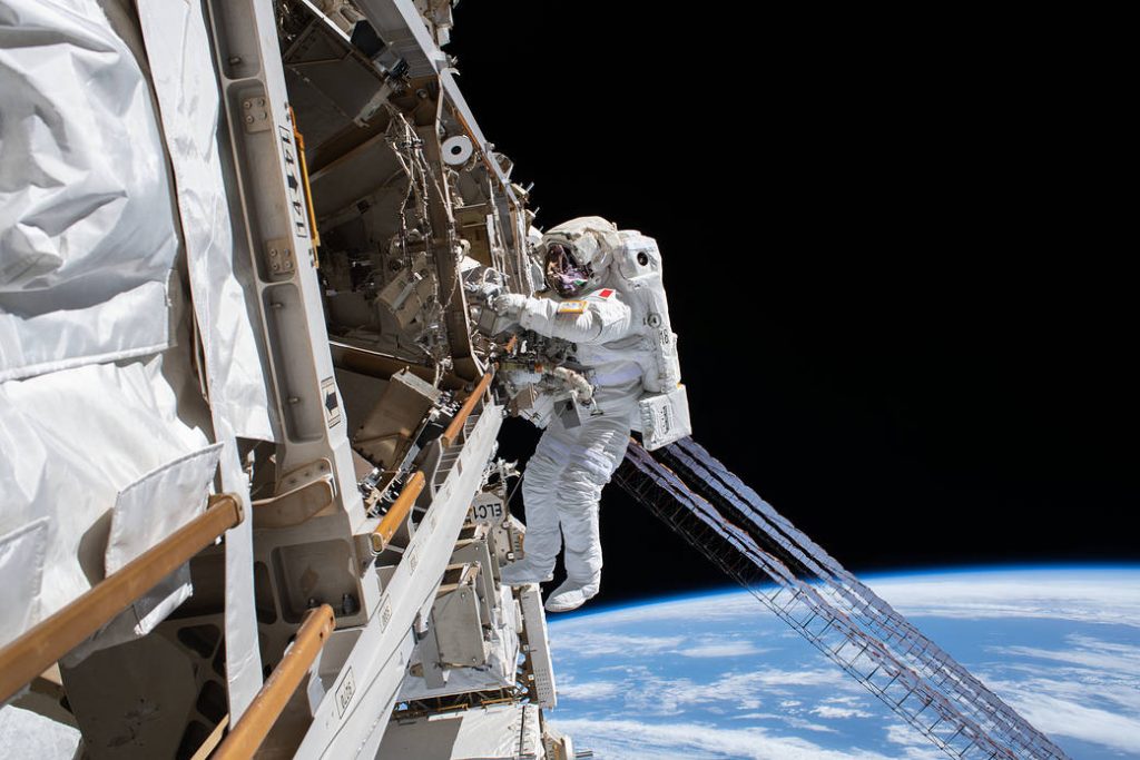 ESA (European Space Agency) astronaut Luca Parmitano is pictured tethered to the International Space Station while finalizing thermal repairs on the Alpha Magnetic Spectrometer, a dark matter and antimatter detector, during a spacewalk that lasted 6 hours and 16 minutes.
