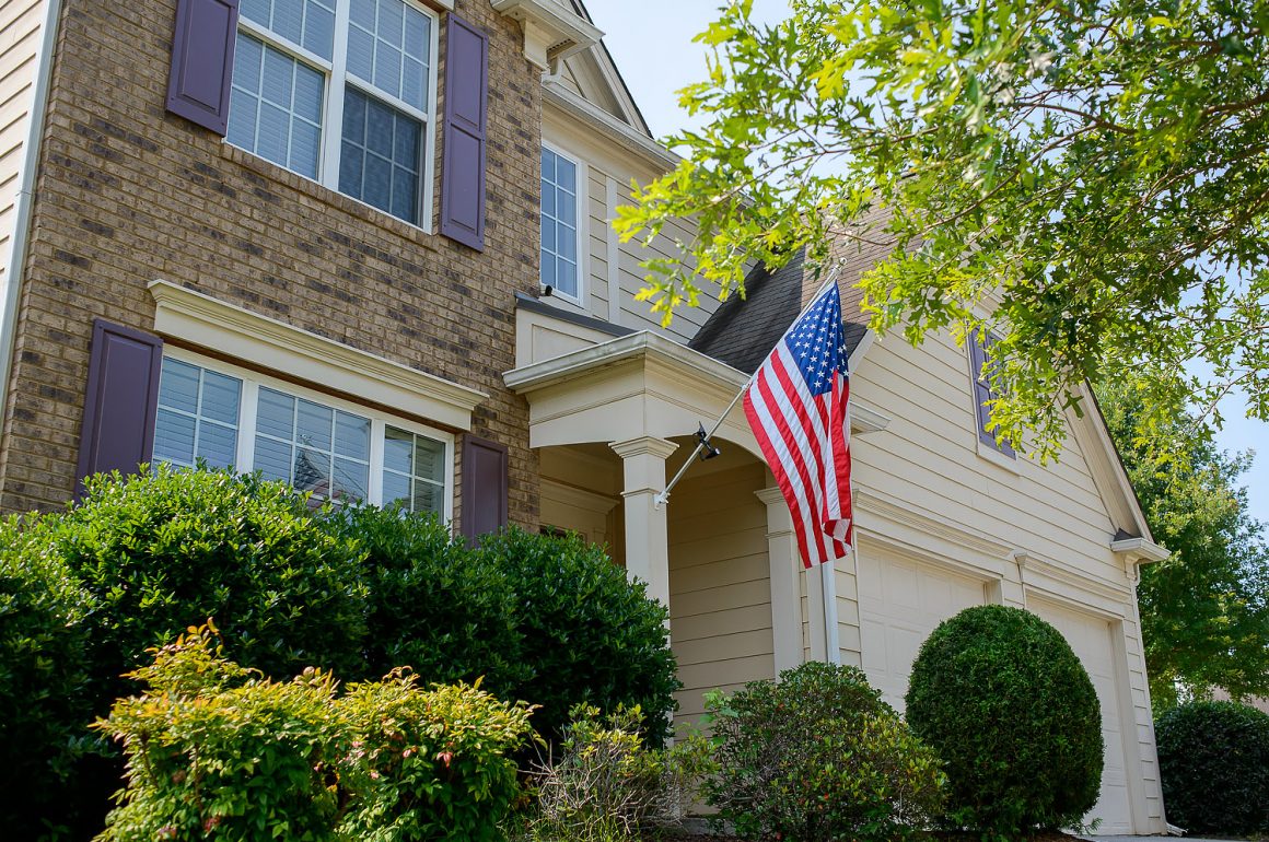 home security podcast, home exterior with American flag