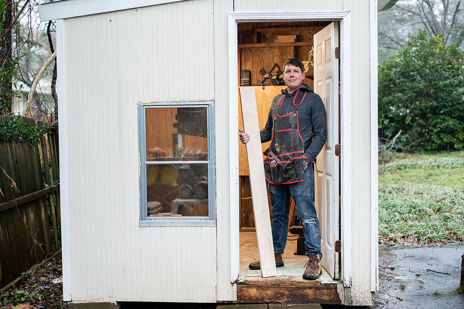 Drew Mapleswright standing in the doorway of his workshop